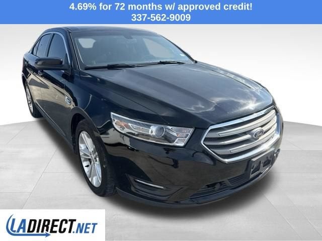 2016 Ford Taurus SEL in Shadow Black — front three-quarter view
